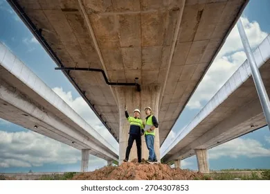 Engineers inspecting an elevated structural corridor